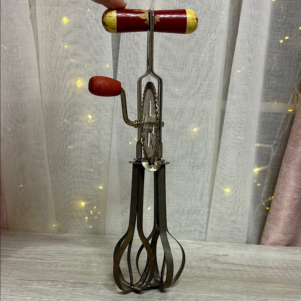 Vintage Handheld Egg Beater with Red Accents